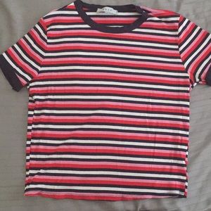 Red, pink, dark blue, and white striped shirt.